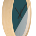 Abstract teal silent wall clock, wooden base, black hands, black markers, 10 inch, side view.