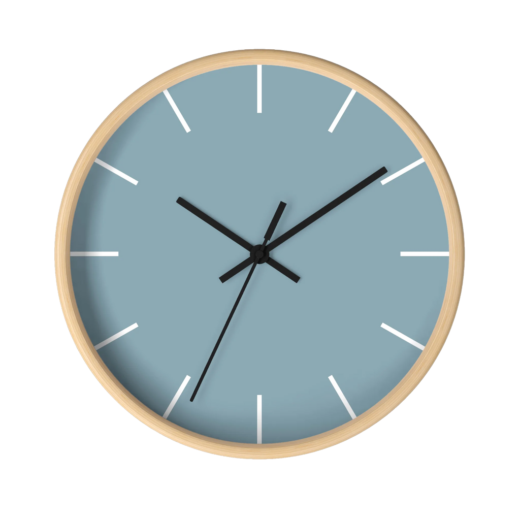Danish blue minimalist wall clock with natural wooden base, black hands, and white markers, front view.