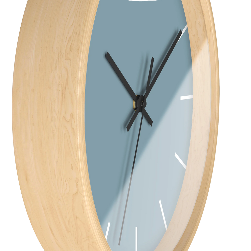 Danish blue minimalist wall clock with natural wooden base, black hands, and white markers, side view.