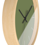 Dark sage olive green silent wall clock, wooden base, black hands, light grey markers, 10 inch, side view.