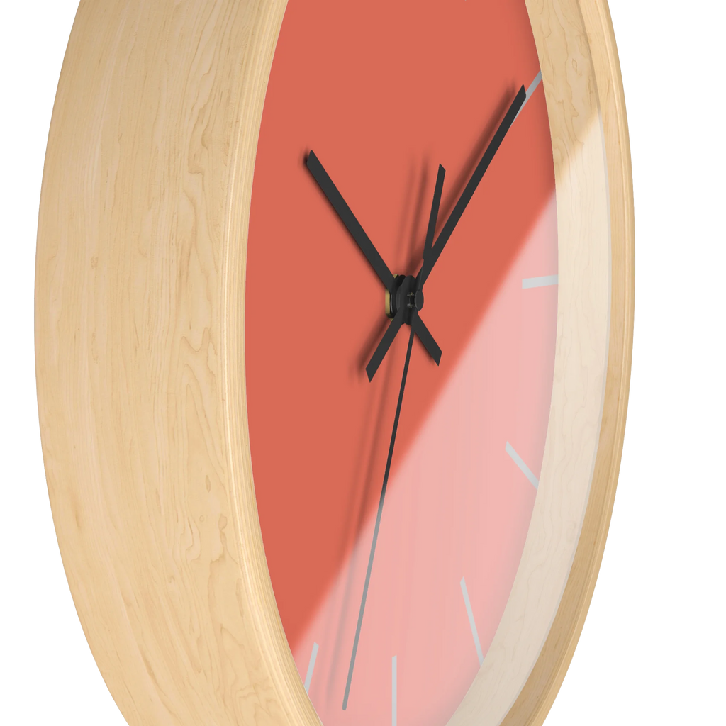 Salmon red coral silent wall clock, wooden base, black hands, light grey markers, 10 inch, side view.
