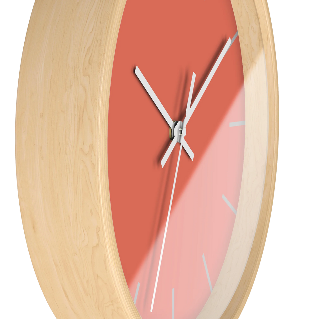 Salmon red coral silent wall clock, wooden base, white hands, light grey markers, 10 inch, side view.